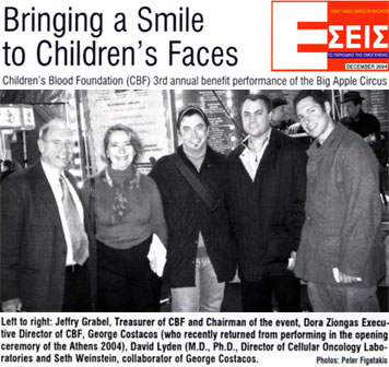 Newspaper clip: You Magazine (Eseis): Title: "Bringing a smile to children's faces." George Costacos at Children's Blood Foundation (CBF) 3rd annual benefit performance of the Big Apple Circus Picturesque. Photo caption excerpt: "George Costacos (who recently returned from performing in the opening ceremony of Athens 2004)." [excerpt from entire clip]